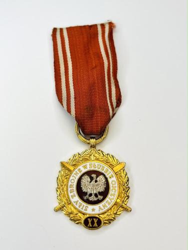 Golden Medal of the Armed Forces in Service of the Fatherland was a military decoration awarded in the Polish People's Republic for impeccable long-term service or work in the armed forces. Initially, the medal was awarded by the President, and from 1968 by the Minister of National Defense.