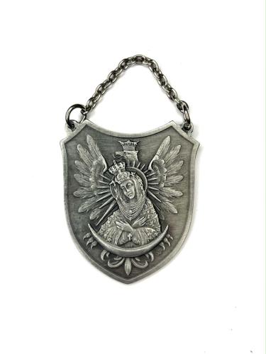 The medallion depicts the Mother of God in the Ostrobramska type - one of the most important Marian images for Poles. The medallion also shows an eagle in a crown, a symbol of Polish independence. The entire piece is made of metal, and it holds deep religious and national significance for Poles.Lupaszka - replica. Used by the Home Army 1944 - 1956